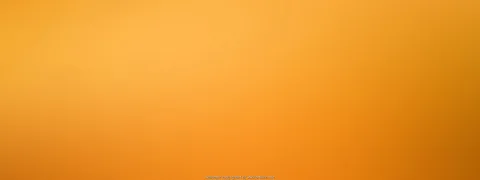 Unscharfer Farbverlauf in Orange, von hellem Gelb oben links zu tieferem Orangebraun unten rechts.