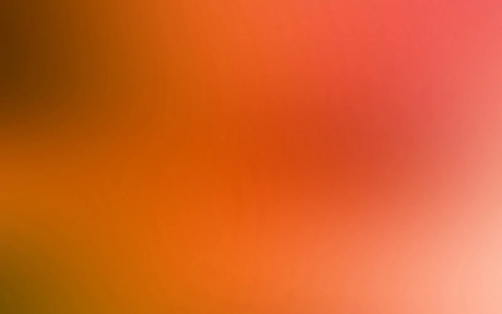 Weicher Farbverlauf von dunklem Braun links über Orange bis zu Rot und hellem Rosa rechts unten