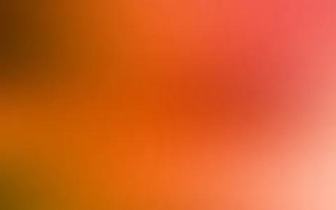 Weicher Farbverlauf von dunklem Braun links über Orange bis zu Rot und hellem Rosa rechts unten