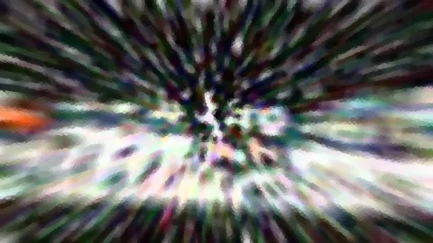 Abstrakte, radial verwischte Farbschlieren, die von einem hellen Zentrum nach außen laufen.