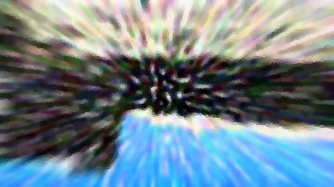 Abstraktes Bild mit radialer Bewegungsunschärfe: Farbstreifen laufen von einem dunklen Zentrum nach außen, unten dominiert ein helles Blau.