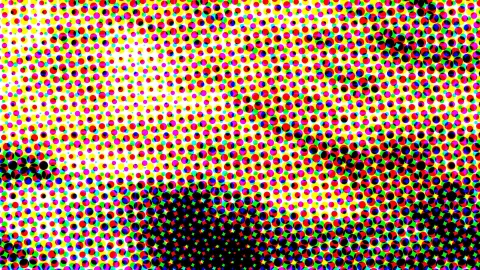 Dichtes Raster aus bunten Punkten in Rot, Gelb, Magenta, Grün, Blau und Schwarz, nach rechts unten dunkler werdend.