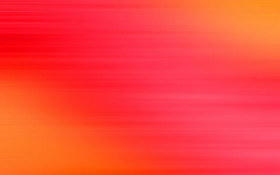 Horizontal verwischte Streifen in Rot und Orange, die von links unten nach rechts oben ineinander übergehen.